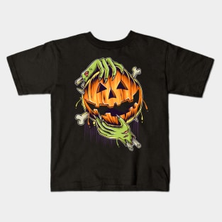 halloween pumpkin in zombie hands Kids T-Shirt